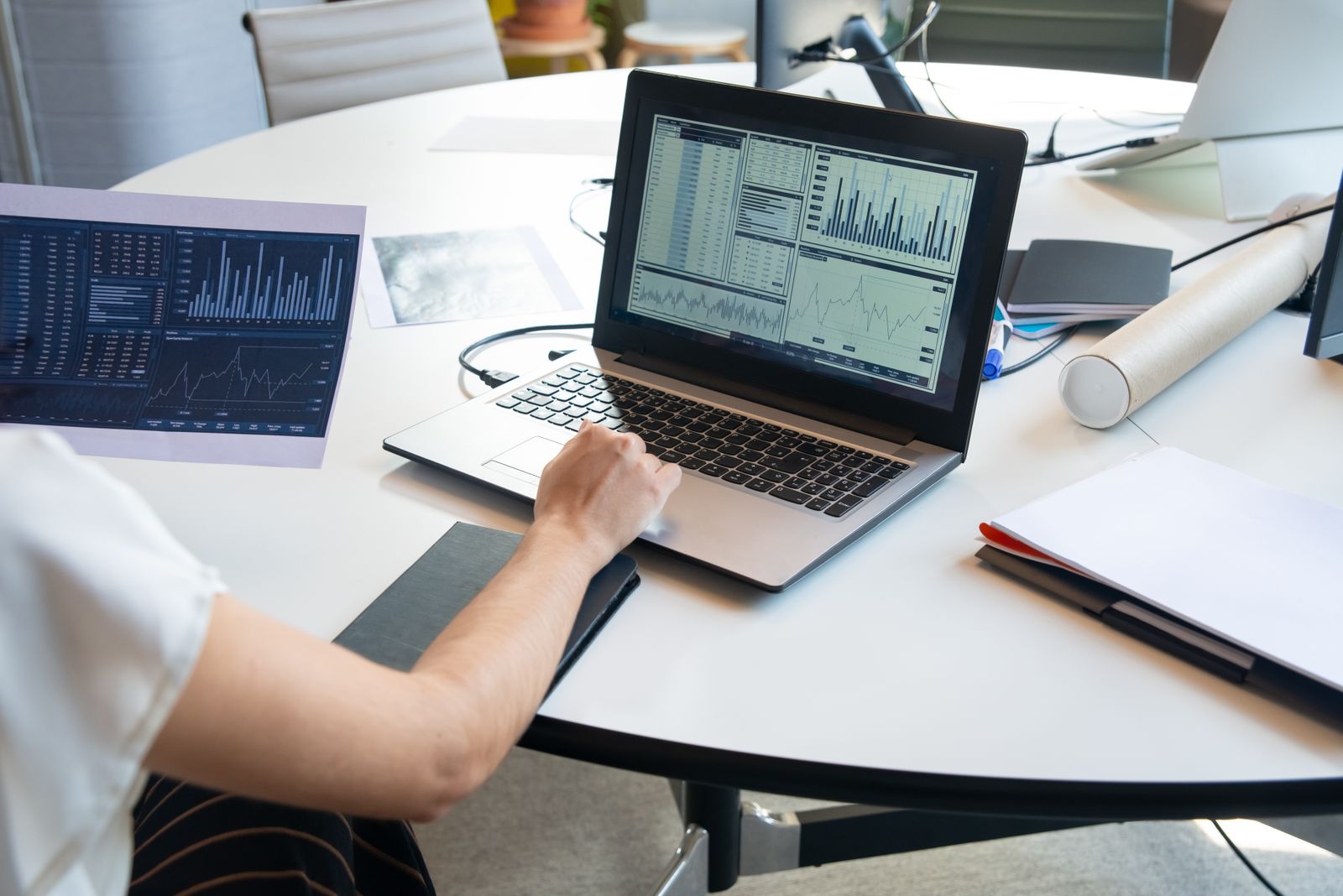 Home Consultant reviewing infrastructure monitoring dashboards on a laptop