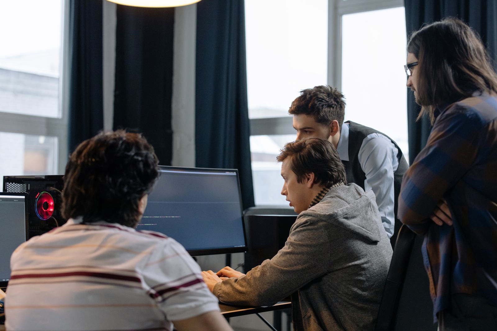 IT consultants reviewing systems together at a workstation